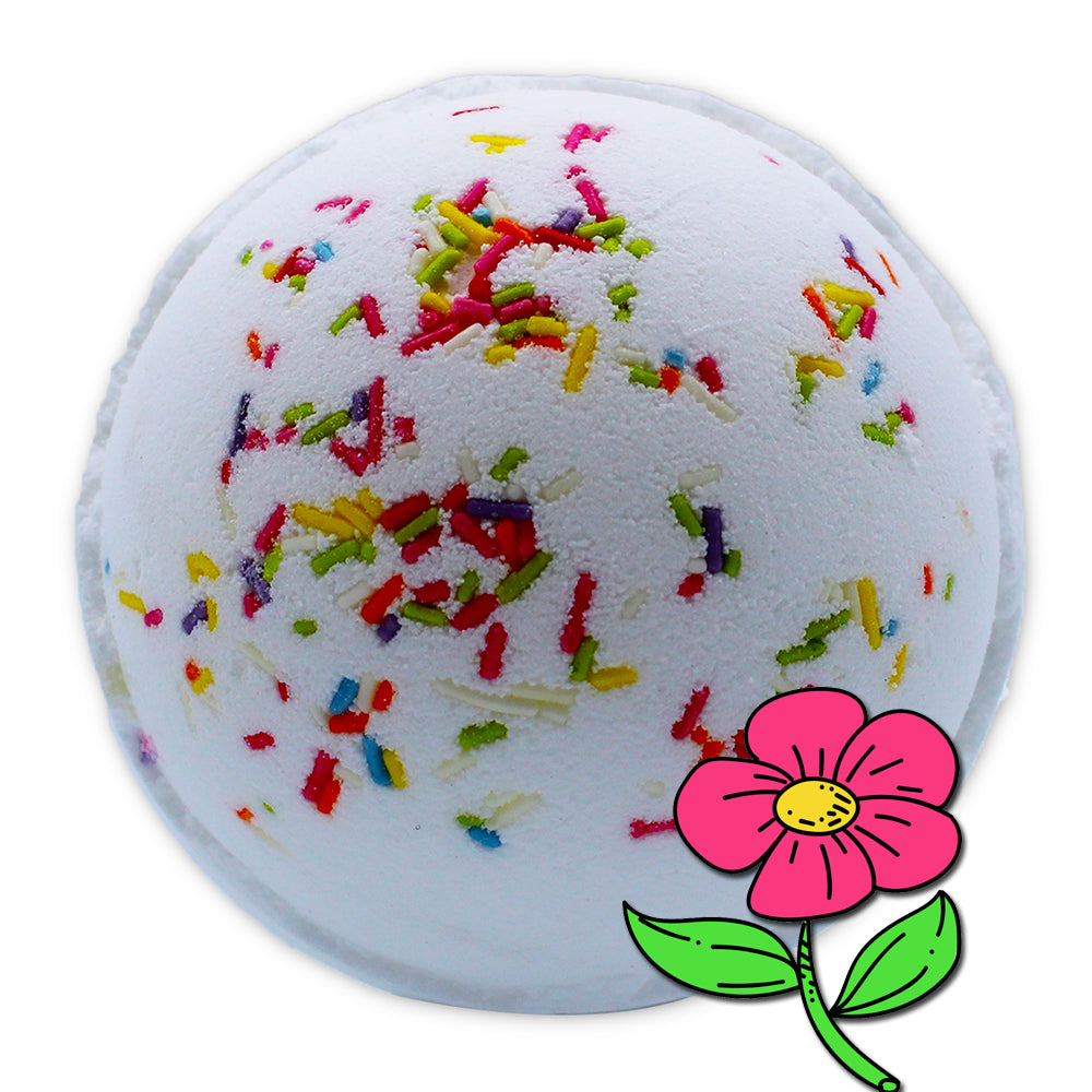 A white, spherical bath bomb is decorated with colorful sprinkles, accompanied by a simplistic illustration of a pink flower adjacent to it, set against a plain white background.