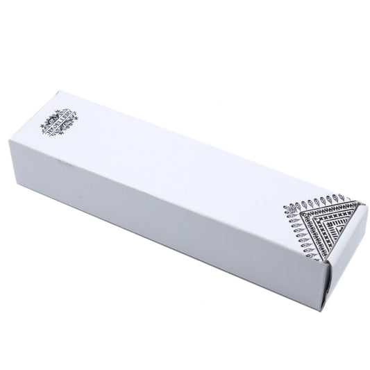 White rectangular jewelry box lies angled on a white background, decorated with a black triangular patterned corner and a small ornate logo reading "JEWELLERY" on the lid.