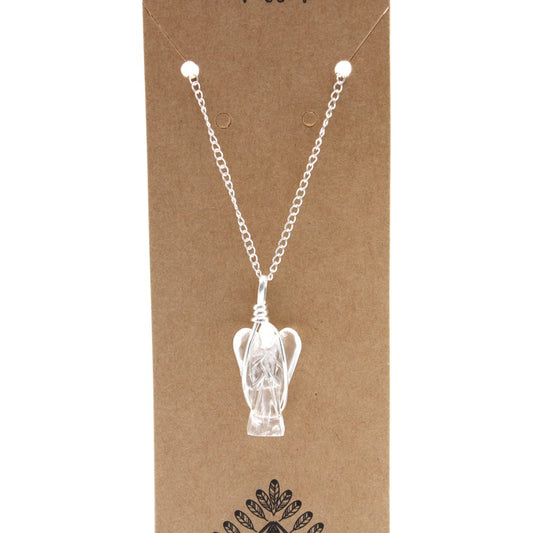 A crystal angel pendant hangs on a silver chain, displayed against a brown cardboard backing featuring a tribal leaf design.