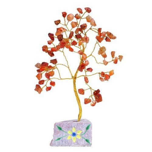 A small, decorative wire tree is covered in carnelian stones and “grows” from a painted rock base with a flower design, presented against a white background.