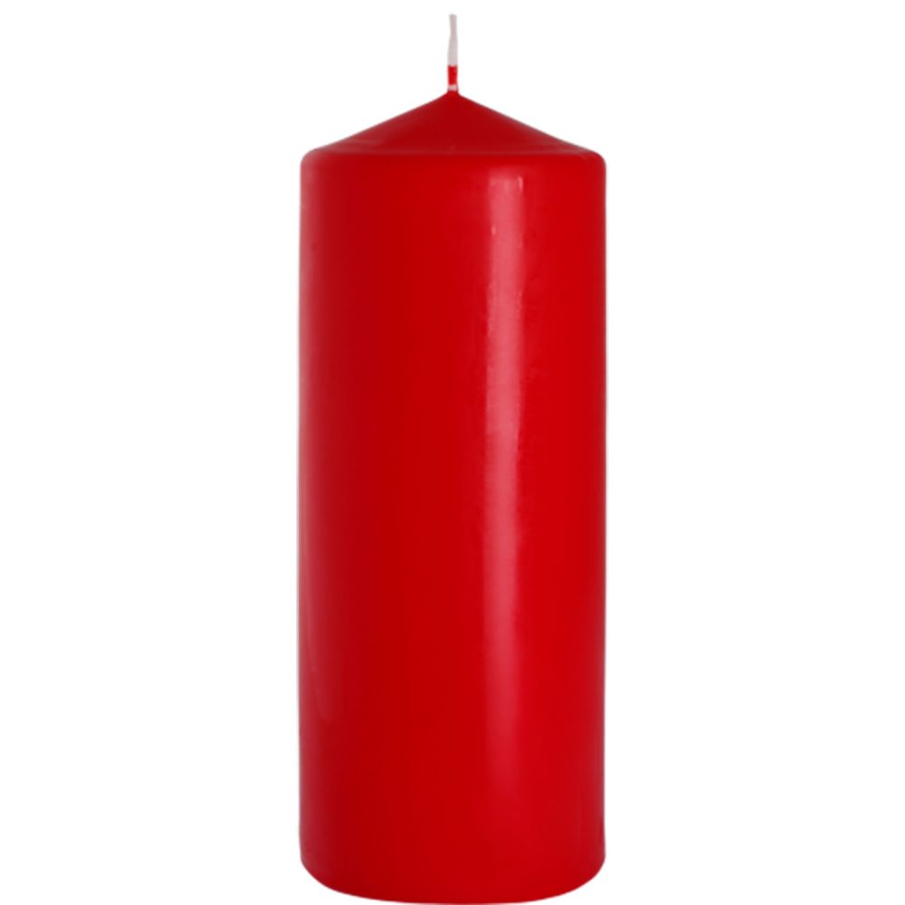 A red pillar candle stands on a white background. It has a wick that is ready to be lit.
