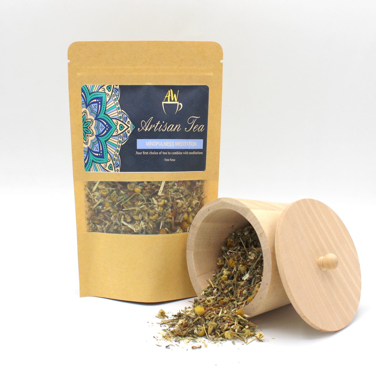 A packet of "Artisan Tea" labeled "MINDFULNESS MEDITATION," featuring herbal loose leaf tea. A wooden container spills tea beside it on a white background. Text: "Your first choice of tea to combine with meditations - Tota Pulchra."