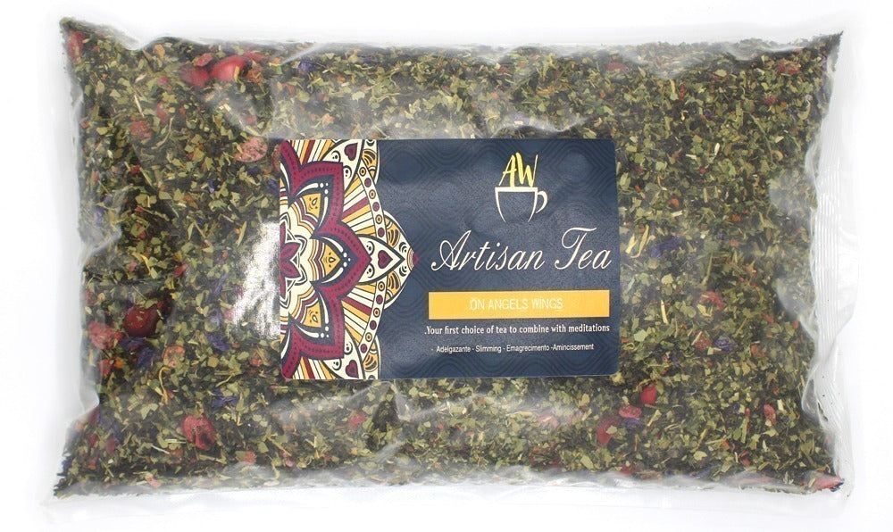 A clear plastic bag contains loose leaf tea, displaying a label: "AW Artisan Tea ON ANGELS WINGS. Your first choice of tea to combine with meditations. Adelgazante - Slimming - Dimagrimento - Amincissement." The label features an ornate design.