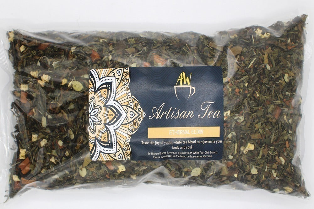 A sealed bag of loose leaf tea labeled "Artisan Tea" features a decorative label reading "ETHERNAL ELIXIR." Text promises a rejuvenating white tea blend for body and soul.