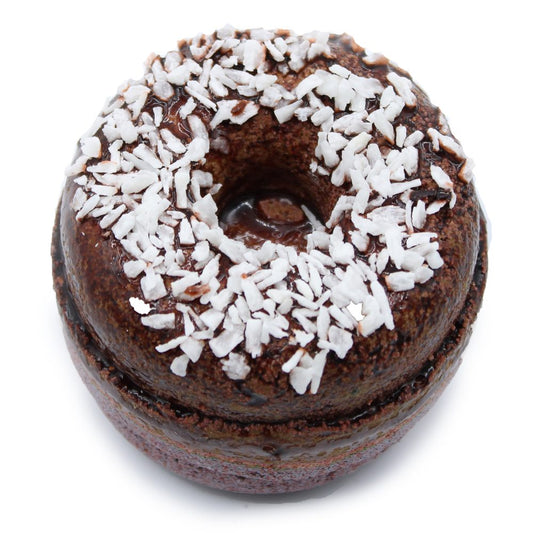 A chocolate donut topped with shredded coconut sits on a white background, creating a contrast between the dark glaze and the white topping.