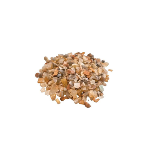 A pile of small, multi-colored rocks sits clustered. The rocks are shades of beige, white, and brown. The context is a white, neutral space.