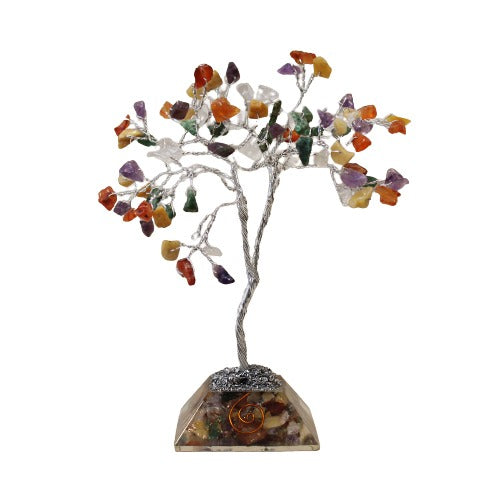 A wire tree stands, adorned with colorful stones for leaves, mounted on a crystal-filled pyramidal base, isolated against a white background.