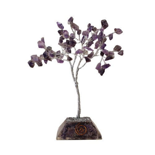 A small tree with a silver wire trunk and branches sprouts from a purple gemstone base. The branches hold small, rough-cut amethyst stones. The background is white.
