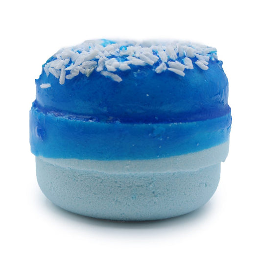 A blue bath bomb shaped like a donut, topped with white flakes, sits against a plain white background. The design includes layered shades of blue, creating a visually striking effect.