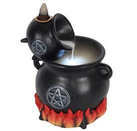 A black cauldron with pentagram symbols pours a white liquid. It is surrounded by red flames, creating a mystical, witch-themed atmosphere.