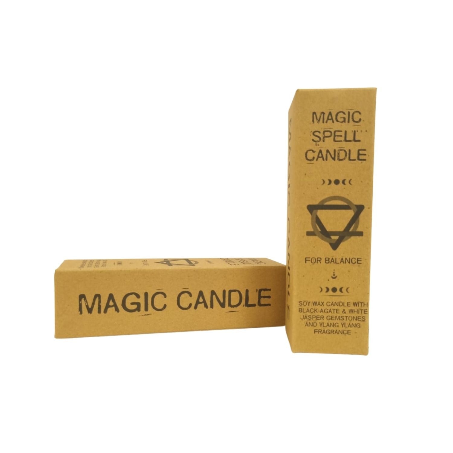Two "Magic Spell Candle" boxes sit on a white surface; one is standing tall, displaying a "For Balance" symbol, while the other is lying horizontally, showing the "Magic Candle" text.