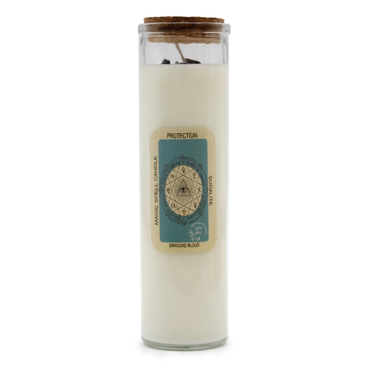 Tall glass jar candle stands upright with a cork lid and unlit wick on a white background; label reads PROTECTION, MAGIC SPELL CANDLE, SODALITE, DRAGONS BLOOD, SOY WAX.