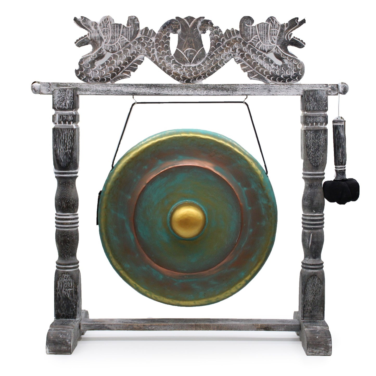 A large, bronze-green gong hangs from a decorated wooden frame with dragon carvings, accompanied by a padded mallet attached to the side, all set against a plain background.