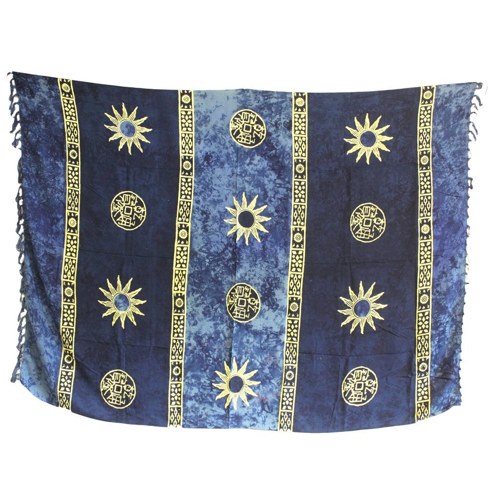 A blue rectangular textile hangs, displaying a pattern of suns and circular symbols in gold.