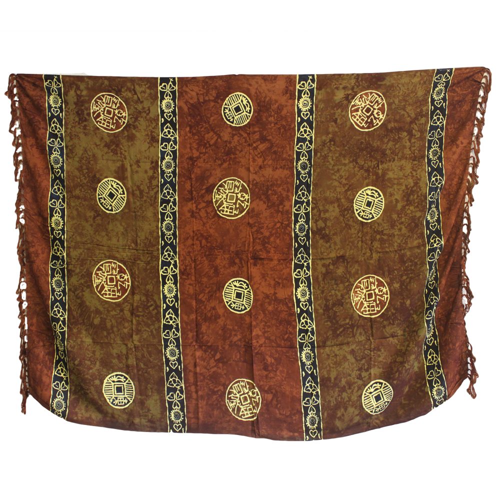 A rayon sarong hangs against a white background; it is patterned with brown and olive-green batik and features repeating circular designs.