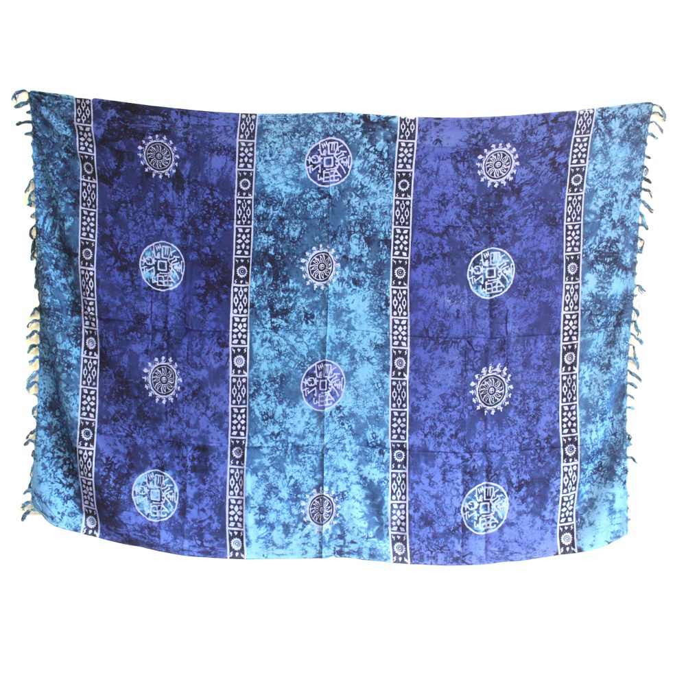 A batik sarong hangs against a white background. The sarong is predominantly blue with lighter blue and white patterned designs.