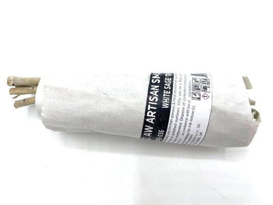 A bundle of white sage is wrapped in white paper with the text "AW ARTISAN SM... WHITE SAGE 10... Dispose of contents/container... AW Artisan S.L." on a white background.
