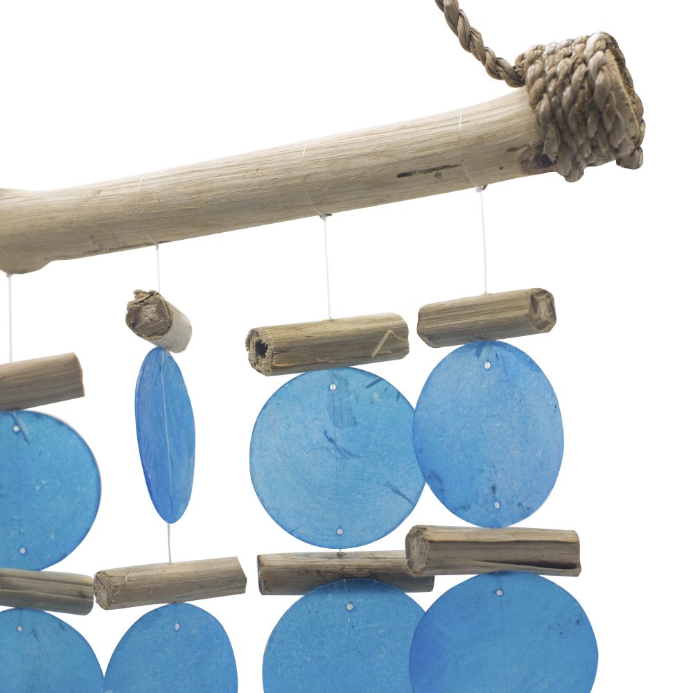 A driftwood mobile hangs, featuring light-blue circular discs interspersed with small, light brown wooden cylinders.