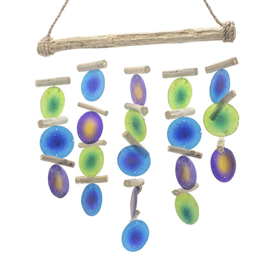 Green & Purple Driftwood Chime handmade with Capiz shell and natural driftwood hanging outdoors.