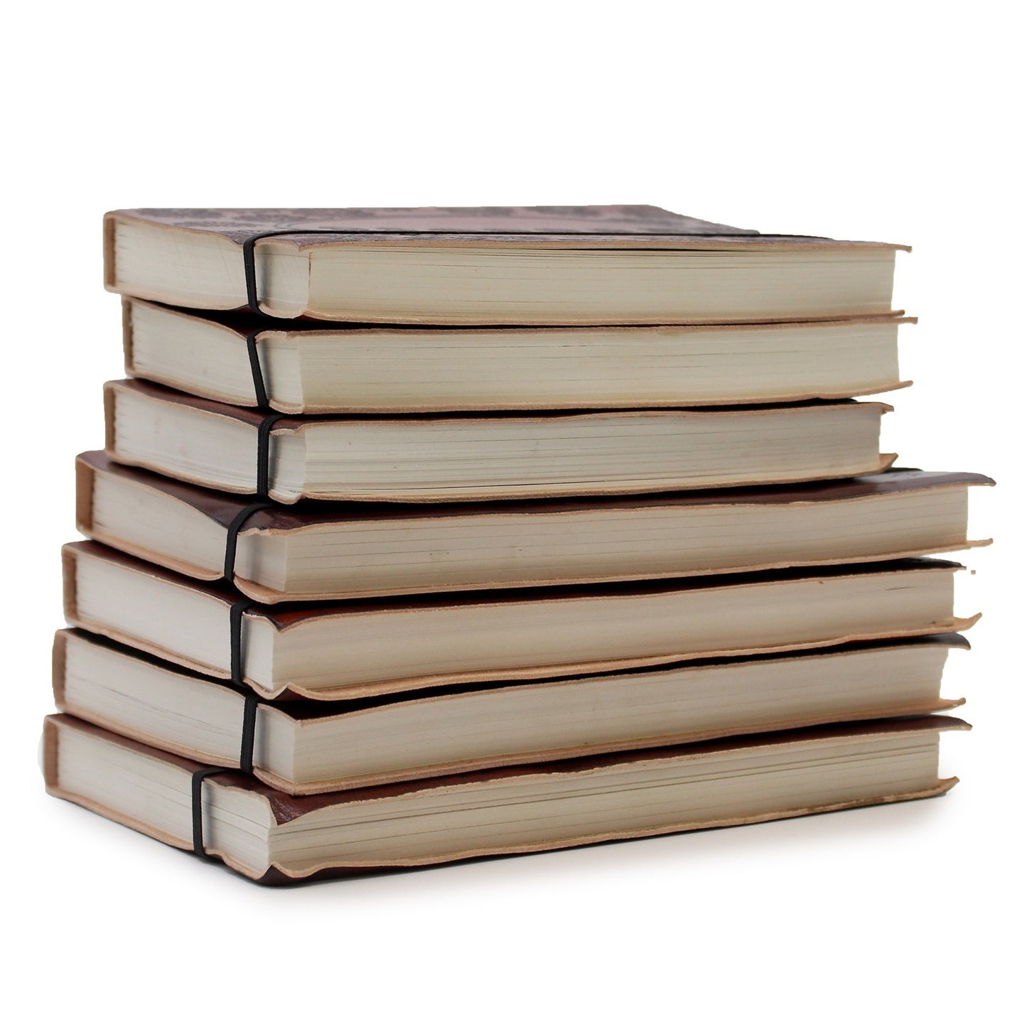 A stack of seven closed journals, bound in brown leather, are stacked on top of one another. Each book is held together by a black elastic band on a white background.