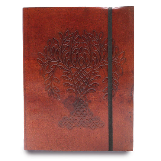 A closed, dark-red leather notebook with a raised tree-of-life design on its front is held closed by a dark-gray elastic band in a bright white space.
