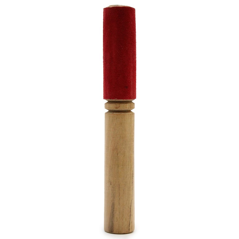A wooden handle supports a red, cylindrical percussion mallet head, designed for striking a xylophone or other similar instruments; the background is plain white, offering no additional context.