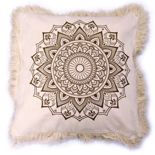 A beige square cushion displays a brown mandala print; it has a frayed edge.