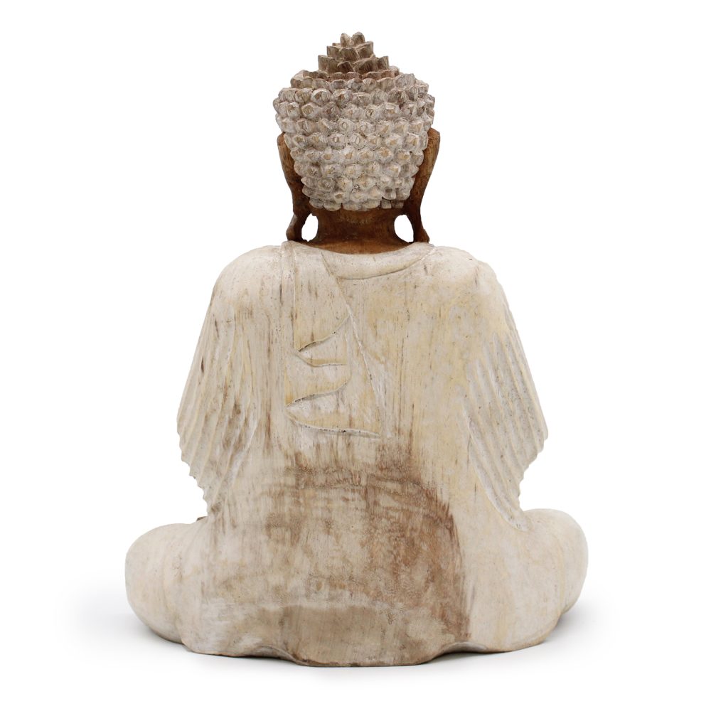 A wooden Buddha statue, with detailed textured hair, sits cross-legged. Its back faces the viewer, highlighting intricately carved robes. The background is plain white, emphasizing the sculpture's features.