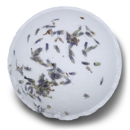 A white bath bomb is covered with scattered lavender buds, resting against a plain white background.