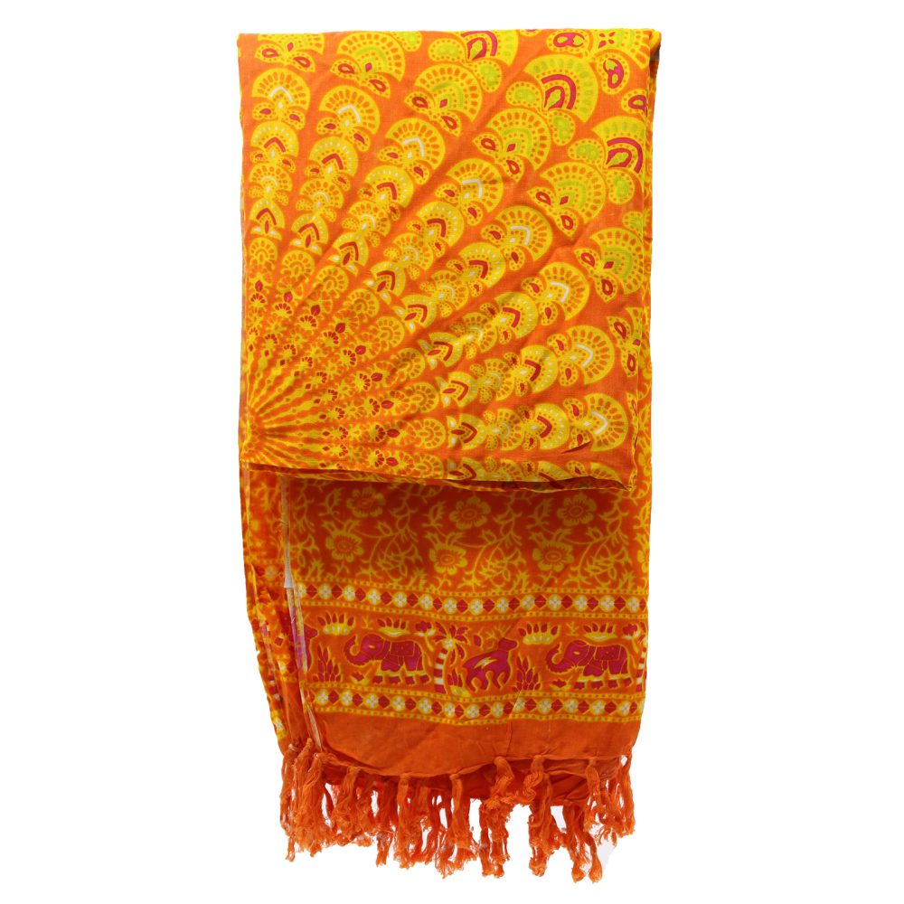 An orange and yellow patterned sarong is folded, displaying its mandala and elephant designs. It has orange tassels at the bottom. The sarong is shown against a white background.