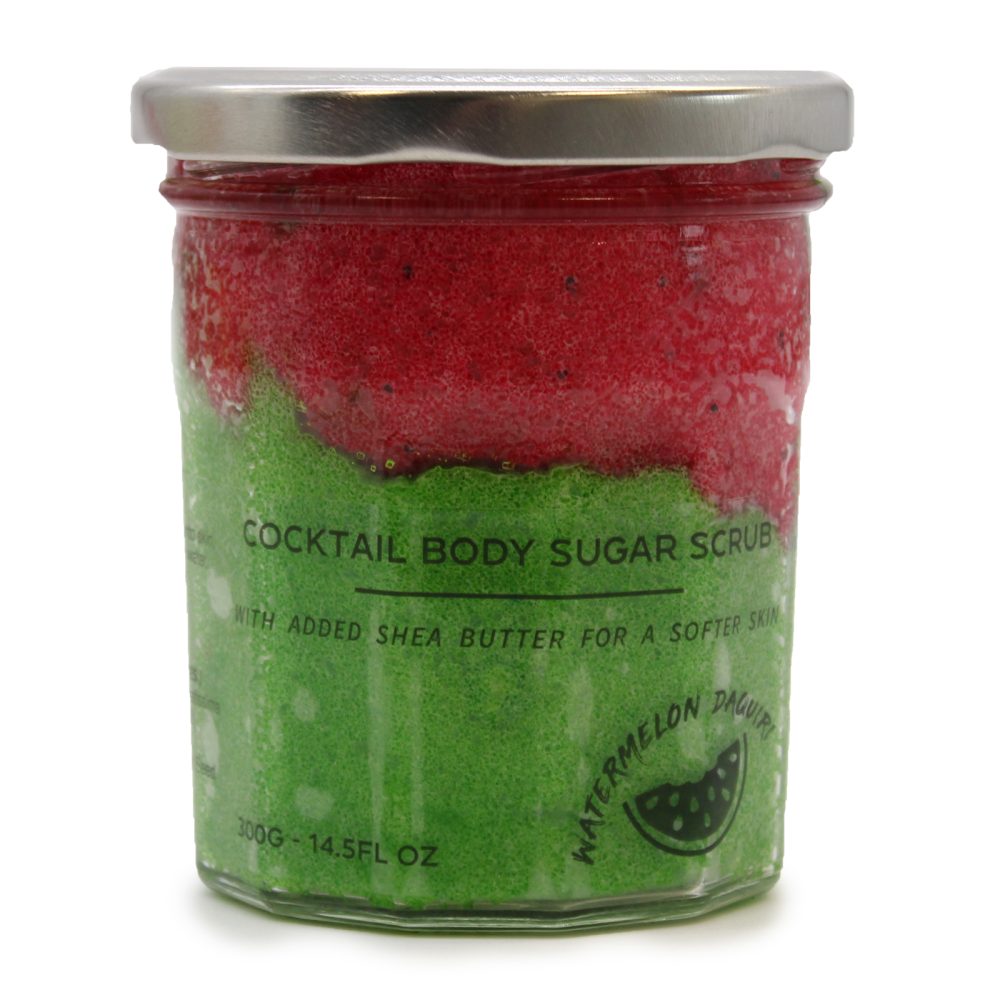 Glass jar filled with red and green sugar scrub with black seeds sits on a white background. The jar label reads "COCKTAIL BODY SUGAR SCRUB. WITH ADDED SHEA BUTTER FOR A SOFTER SKIN. WATERMELON DAQUIRI. 300G-14.5FL OZ."