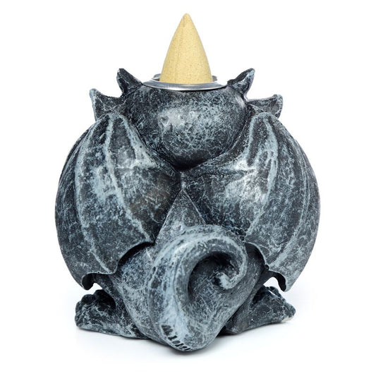 A small, gray stone-like dragon figurine featuring folded wings and a curled tail, holding a cone incense burner on its back, set against a plain white background.