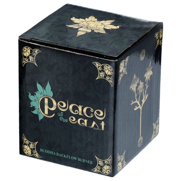 A decorative black box with gold and teal floral accents, labeled "Peace of the East Buddha Backflow Burner," sits upright, featuring intricate corner designs and a floral motif.