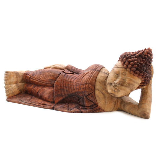 Wooden sculpture of a reclining Buddha resting on one arm, with peaceful expression. The intricate carving highlights the robe and hair details, set against a plain white background.