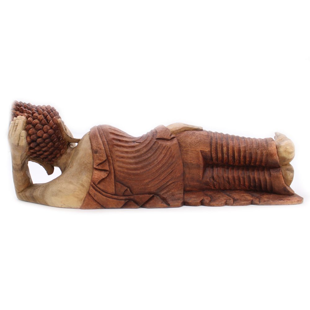 A reclining wooden Buddha statue rests on its right side with an intricately carved robe and detailed hair curls, set against a plain white background.