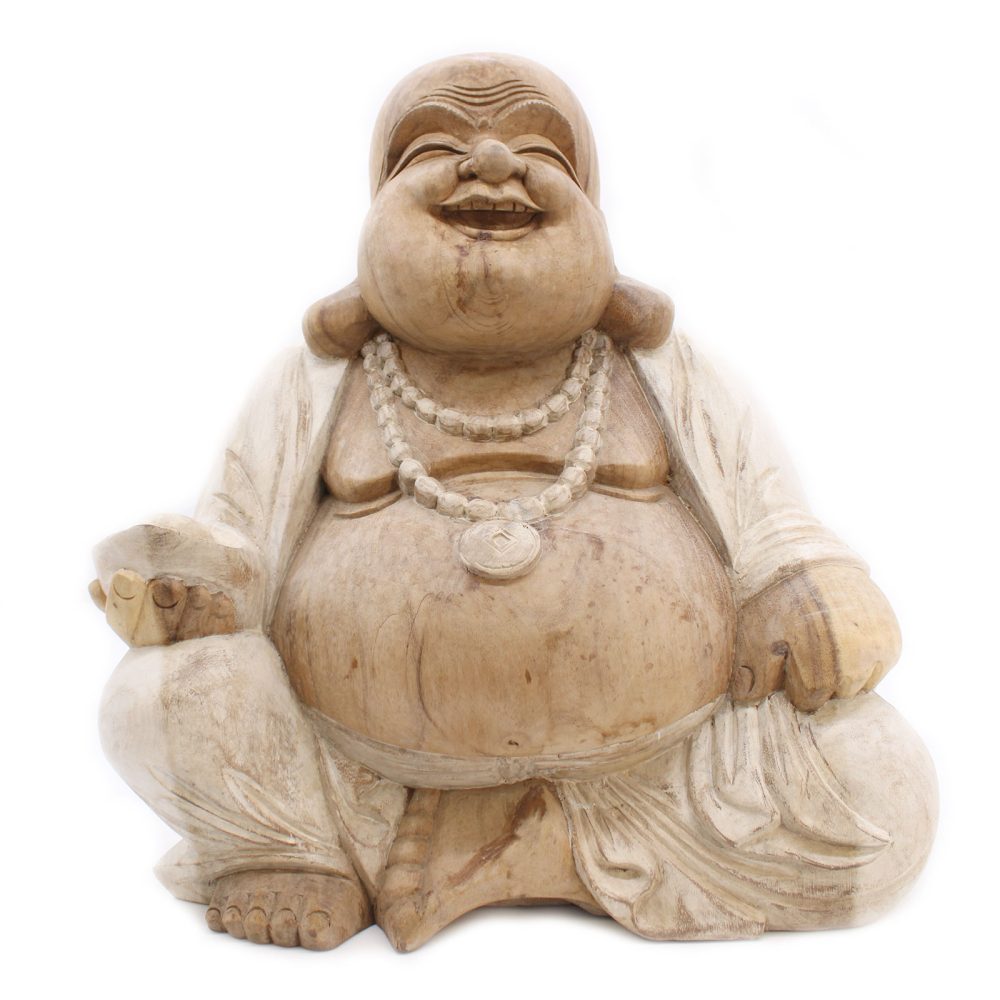 A wooden statue of a laughing, seated Buddha holds a bag in one hand, wearing long robes and a beaded necklace, set against a plain white background.