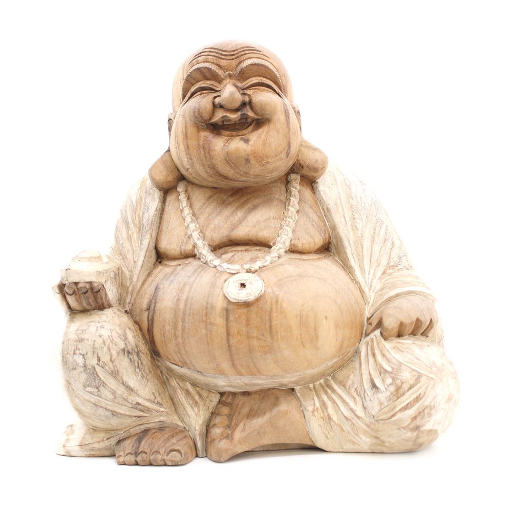 A wooden sculpture of a laughing Buddha sits cross-legged, holding a rice ball in one hand, wearing a beaded necklace, against a plain white background.