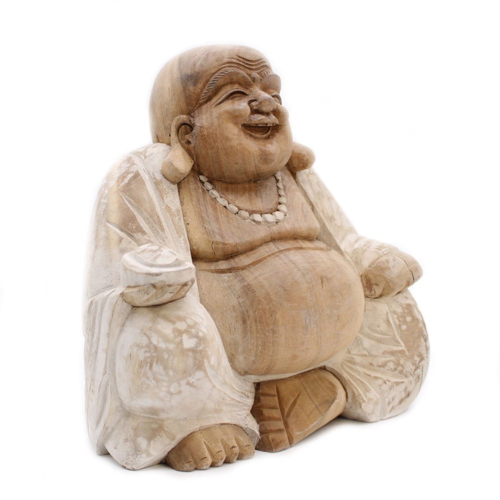 A carved wooden Buddha statue sits joyfully, holding a bowl and wearing a beaded necklace, draped in a textured robe. The background is plain white, highlighting the figure.