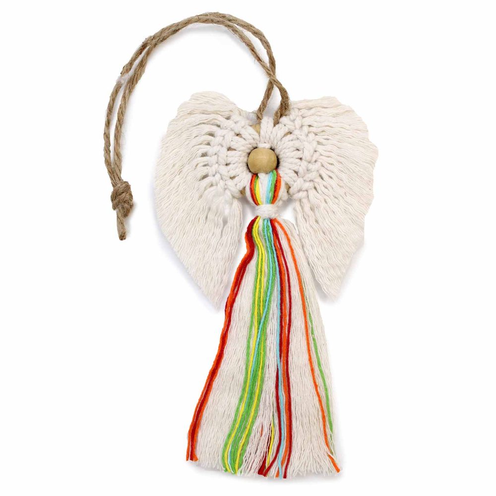 A crocheted white angel with wings and a wooden bead head has a rainbow-colored yarn tassel hanging below, attached with a brown twine hanger, isolated on a white background.
