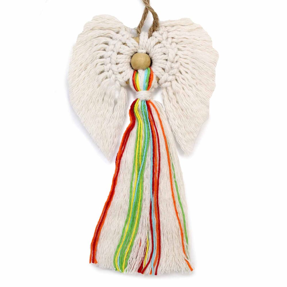 A macrame angel with yarn wings, a wooden bead “head,” and white yarn with colored strands hangs against a white background.