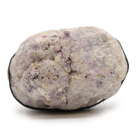A lilac-colored stone speckled with dark spots rests on a stark white surface. A thick black cord loops around part of it.