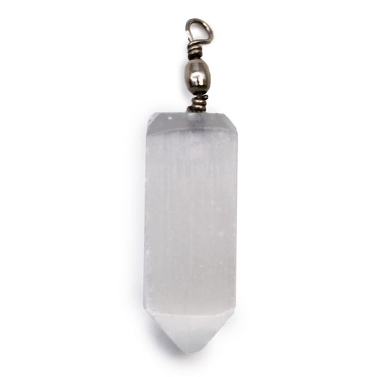 A selenite crystal, shaped like a narrow rectangle with a pointed bottom, is suspended from a metal swivel against a white background.