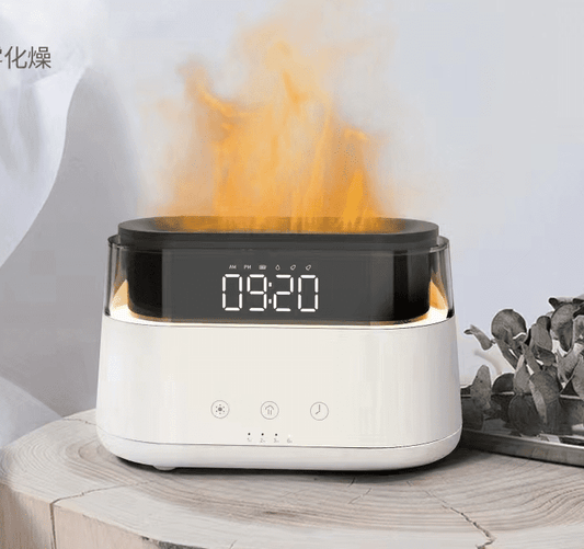 Humidifier projects orange light, creating a flame effect, and displays "09:20" on a digital clock-like screen. It sits on a wooden surface. Text visible: "AM PM 09:20" and "化燥".