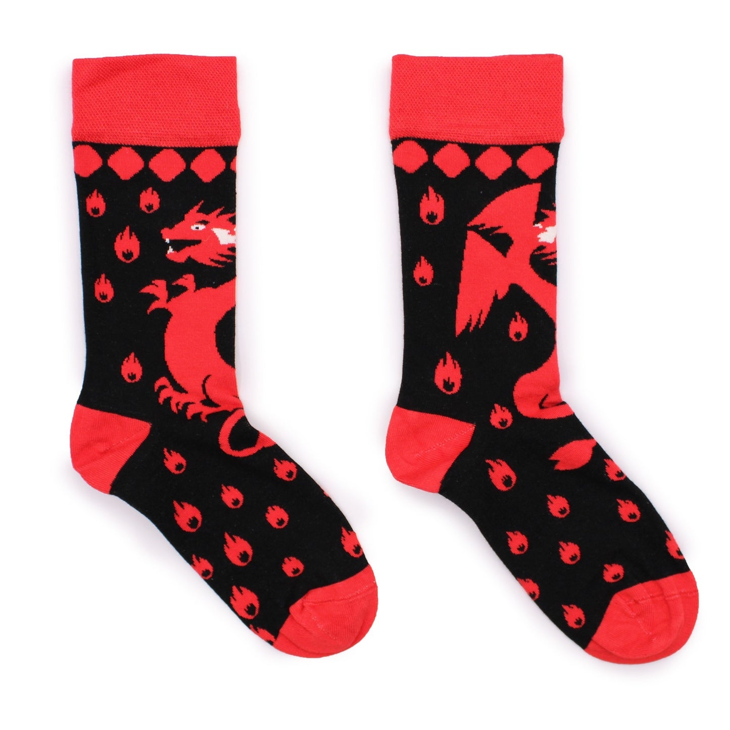 Two red and black socks lay on a white background. Each sock displays a red dragon amidst small red flames.