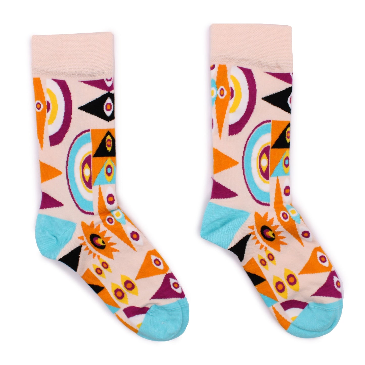 A pair of socks, displaying a geometric pattern in orange, purple, and teal on a cream base, are lying on a white background.