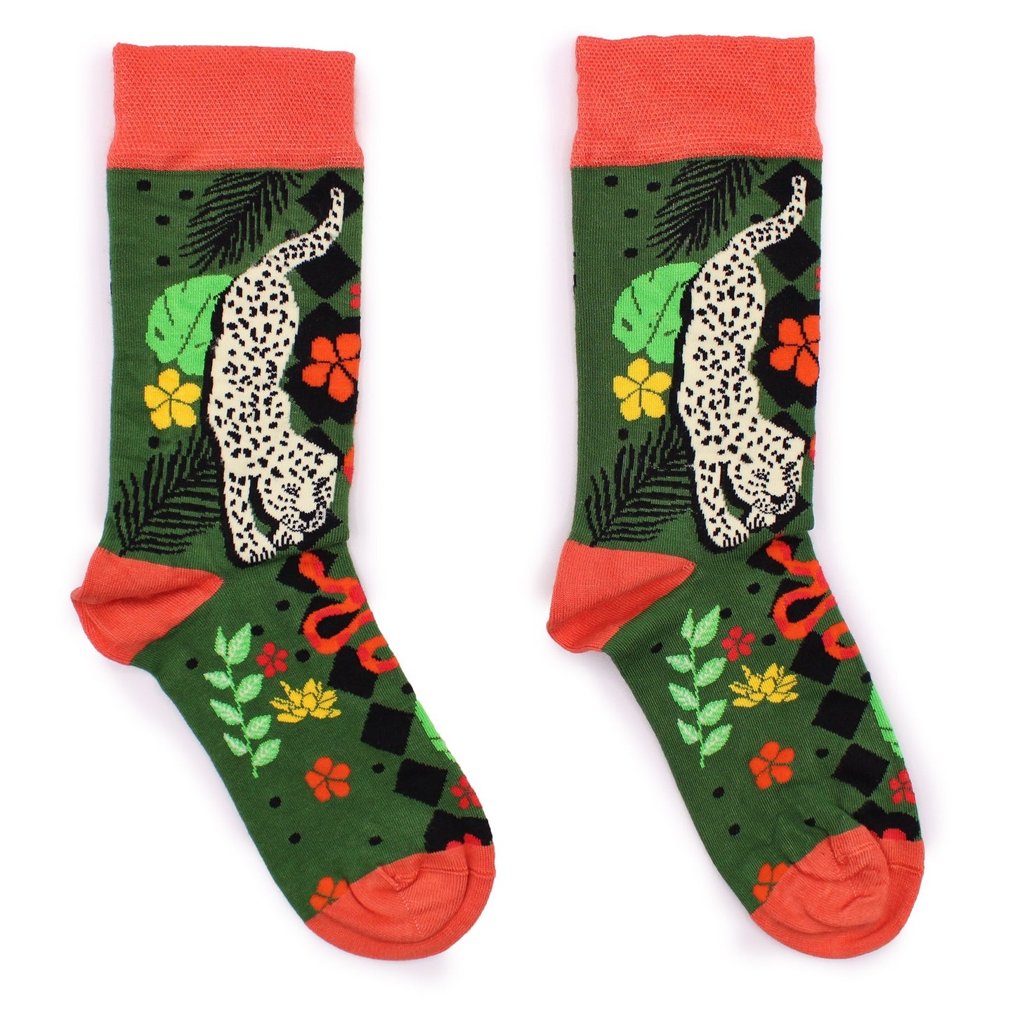 A pair of socks displays a jungle scene with a leopard and snake, featuring tropical plants and flowers. The socks are predominantly green with orange cuffs, lying on a white background.