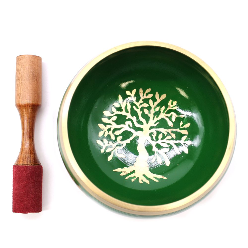 Wooden mallet with red felt lies beside a green singing bowl adorned with a gold tree design, set against a plain white background.