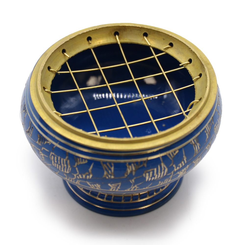 A blue ceramic incense burner features golden patterns and a brass grid atop, set against a clean white background.