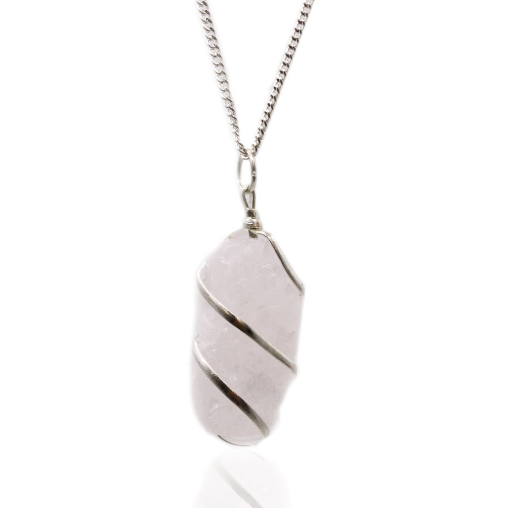 A pinkish crystal pendant hangs from a silver chain. The crystal is wrapped with silver wire in a spiral pattern against a bright, white background.