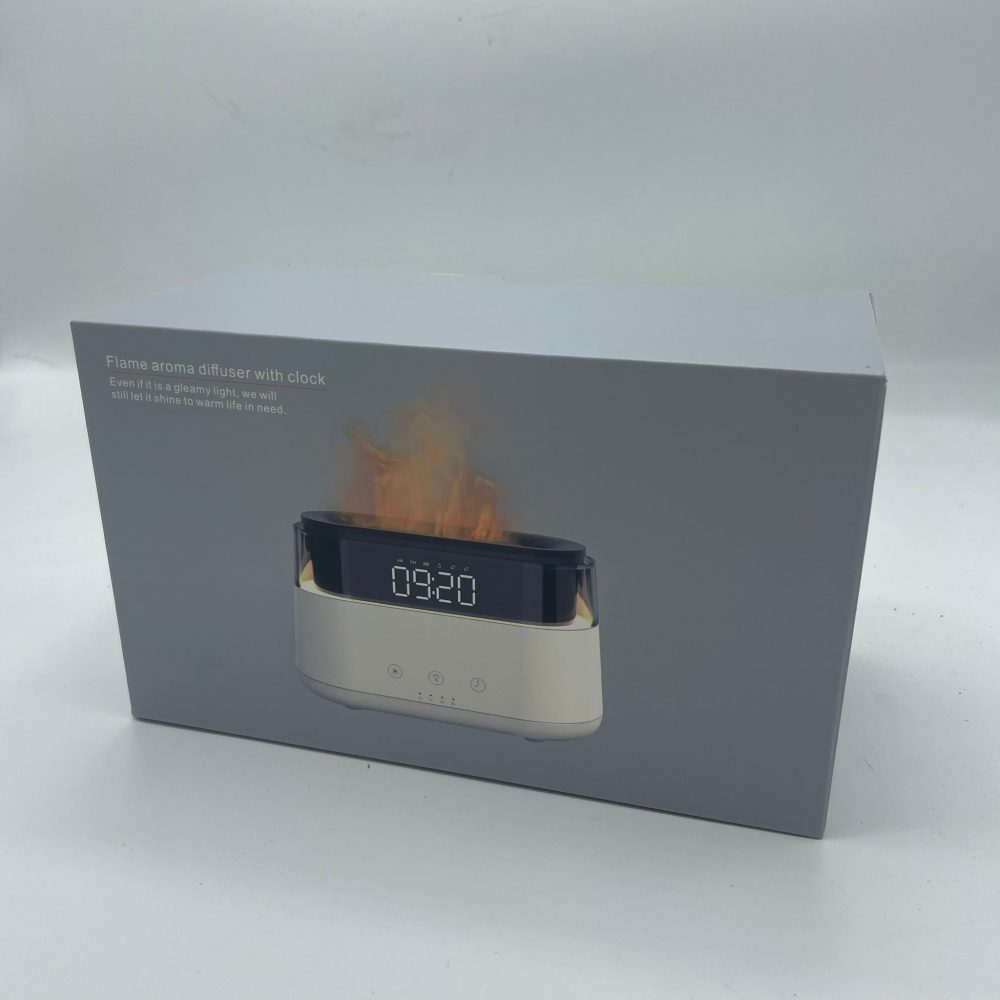 A grey box displays a “Flame aroma diffuser with clock.” The box also says, "Even if it is a gleamy light, we will still let it shine to warm life in need" and an image of the product which reads “09:20” on its display.